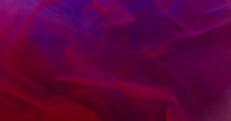 Reddish and blue mists flow and swirl
