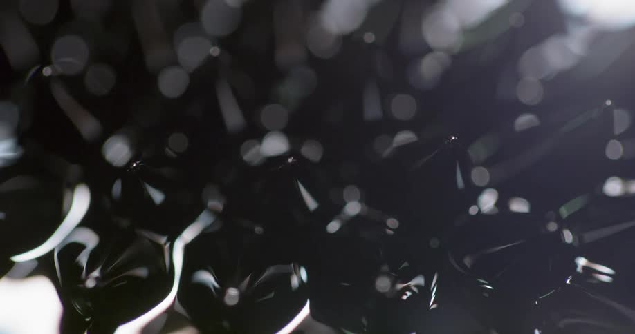 Black oily looking spikes in light and shadow metal liquid magnet