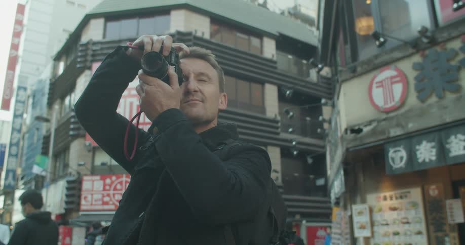 A man is touring and photographing the city