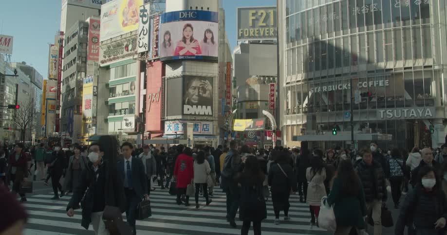 A large crowd of people at Shibuya Crossing in Tokyo