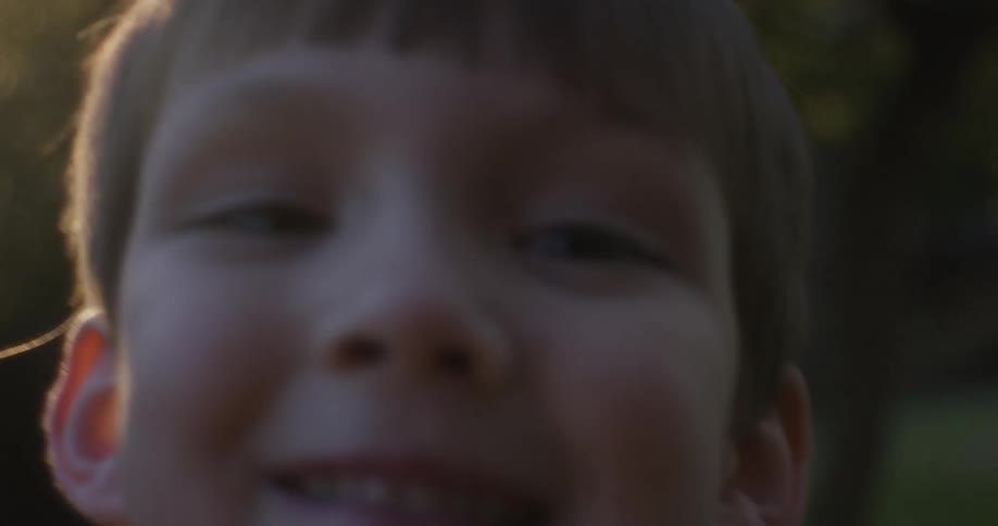 A boy with brown hair smiles