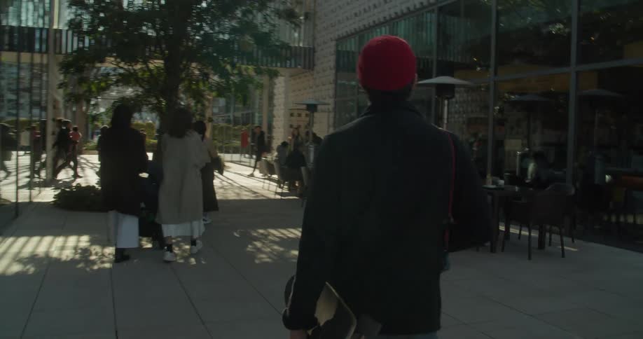 People walking down a street of shops and restaurants