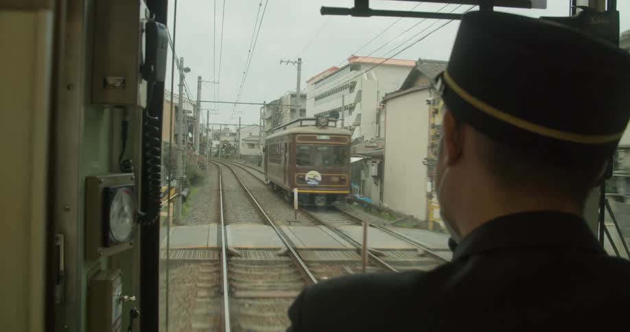 A conductor driving a train