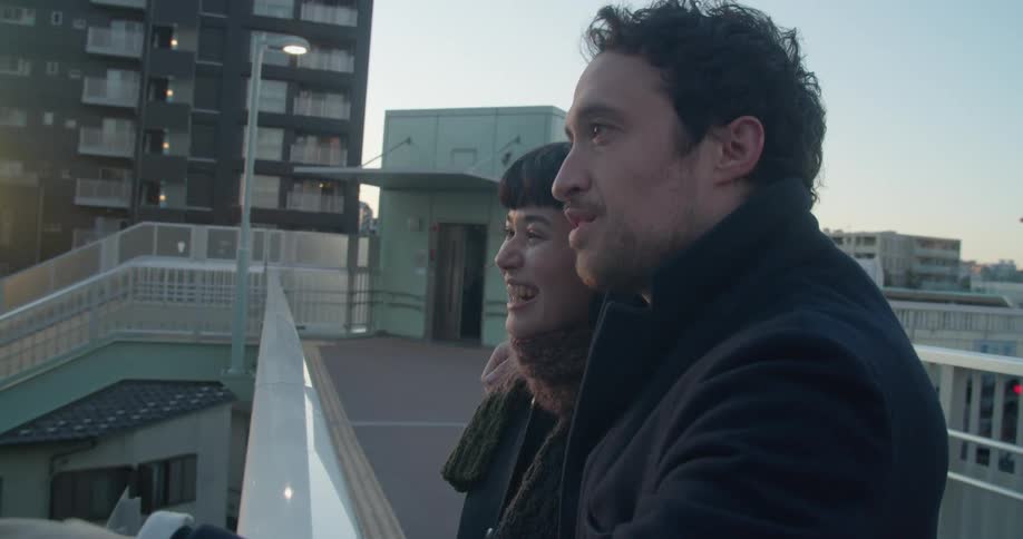 A man talks to a woman