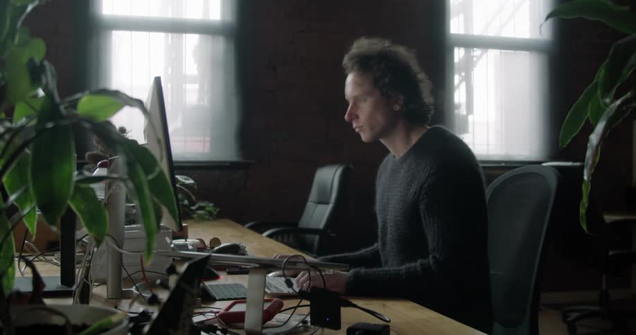 Timelapse of a man working at office desk