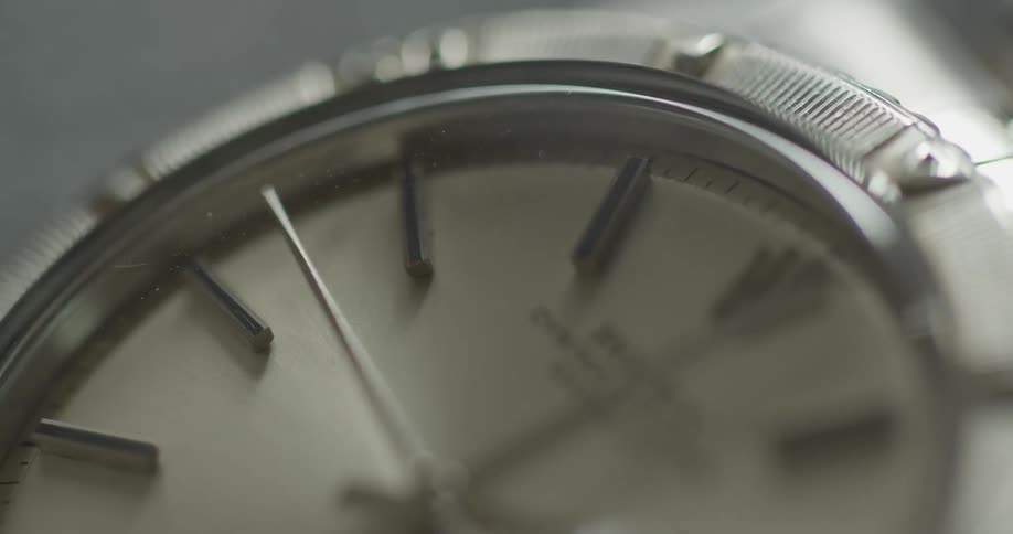 Close up of second hand moving clockwise on silver wrist watch