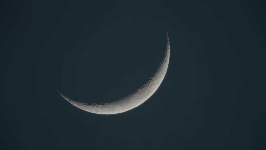 View of the half moon in the sky