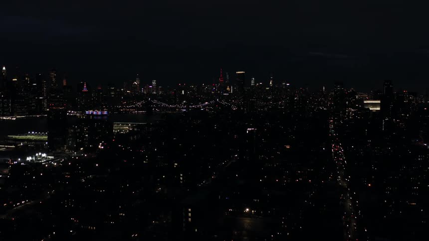 Aerial View of Streets and Skyline at Night