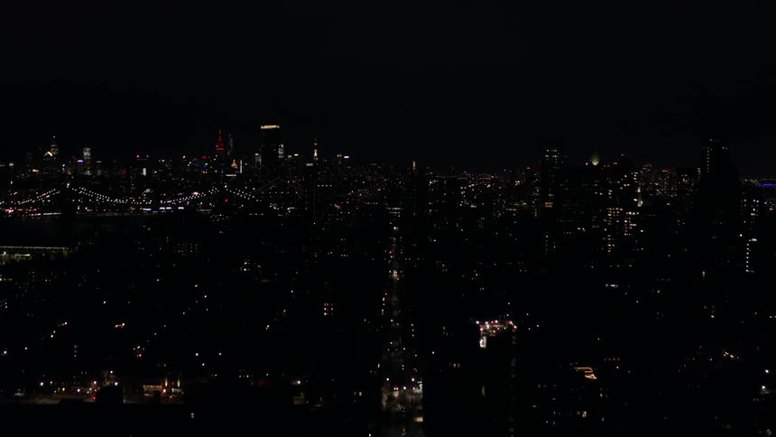 City Skyline at Night with Illuminated Bridges
