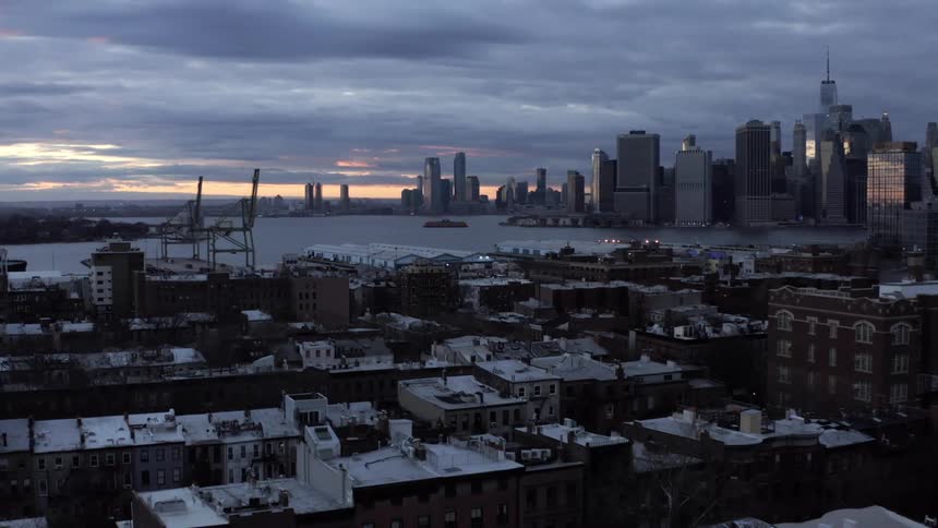 A neighborhood with the water and the skyline in the distance