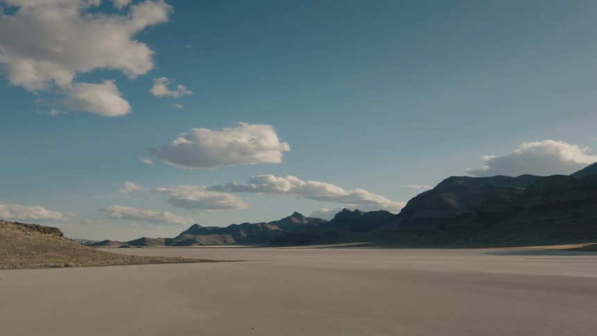 Landscape of a desert with hills in the background