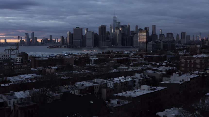 Aerial view of the city skyline and housing estate at dusk