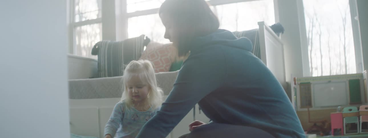 A toddler playing in the living room