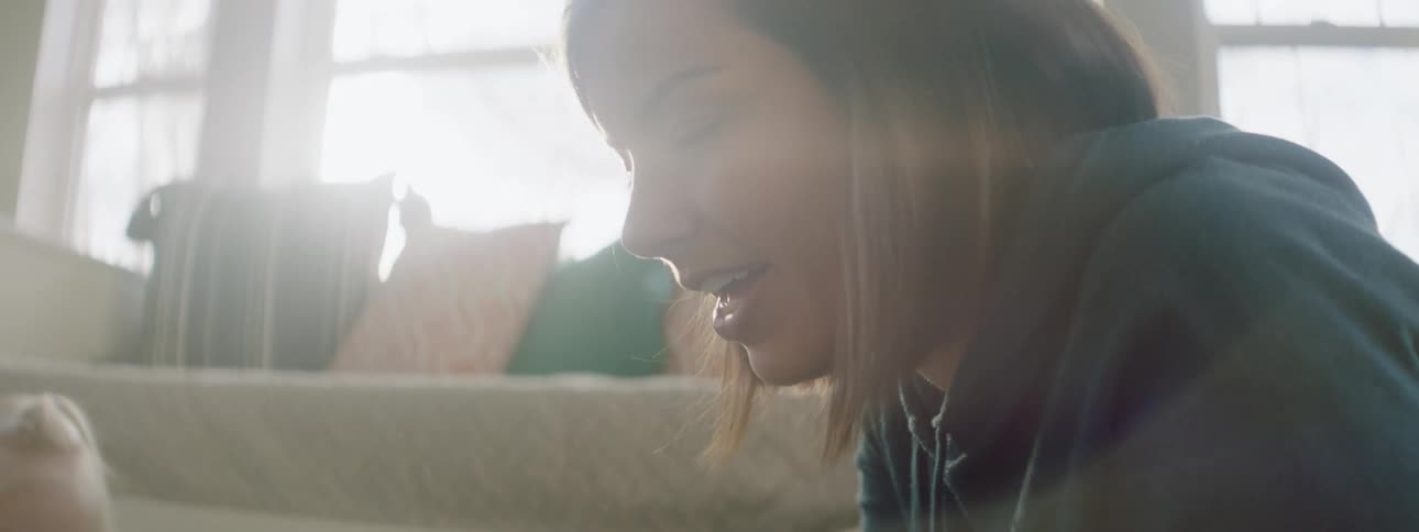 A mother and daughter playing in the living room