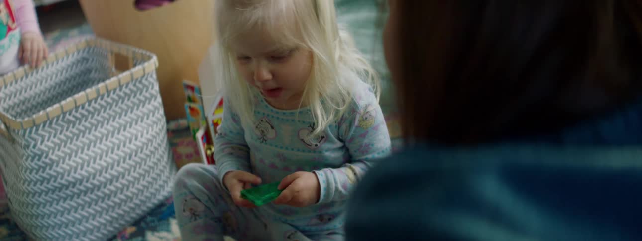 Mother and daughters play the living room at home