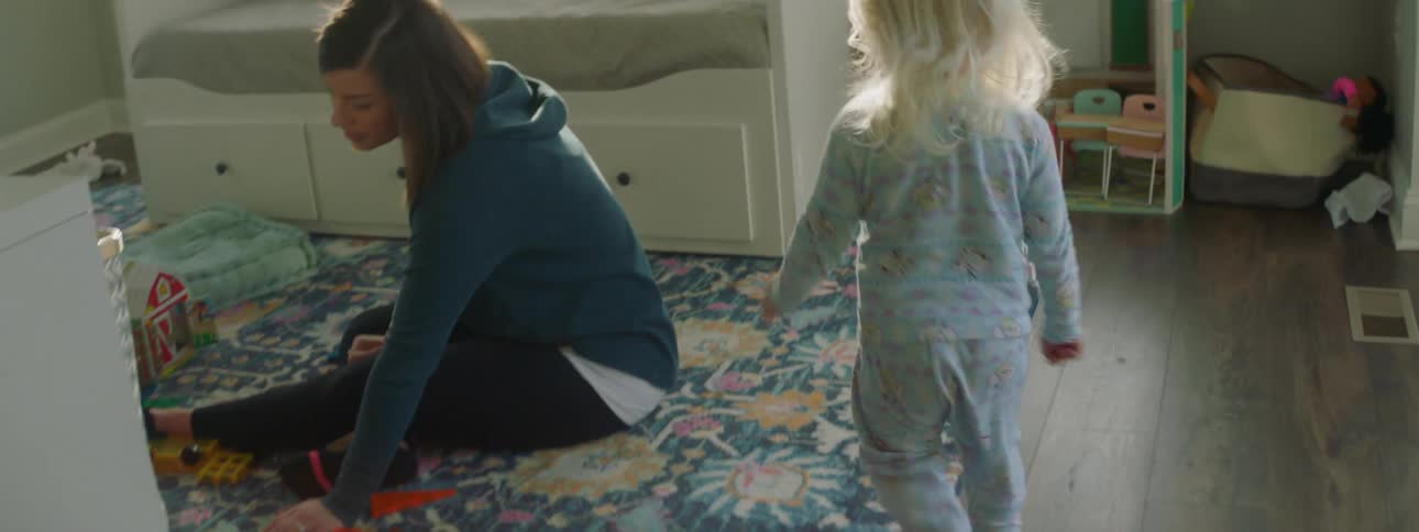 A child runs into the living room