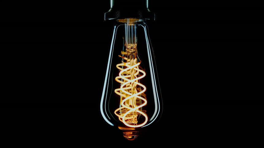 Vintage style light bulb turning off and on