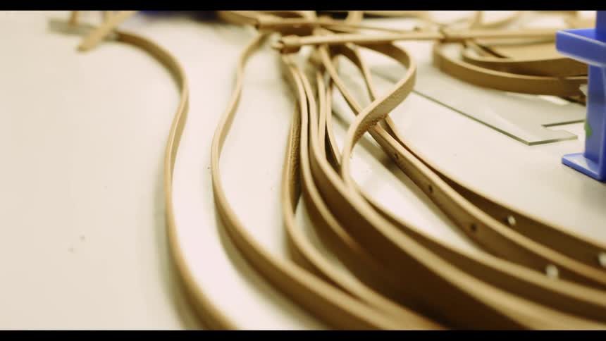 Belts lying on a counter in a factory