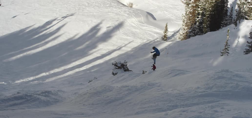 People are skiing in an area covered with snow