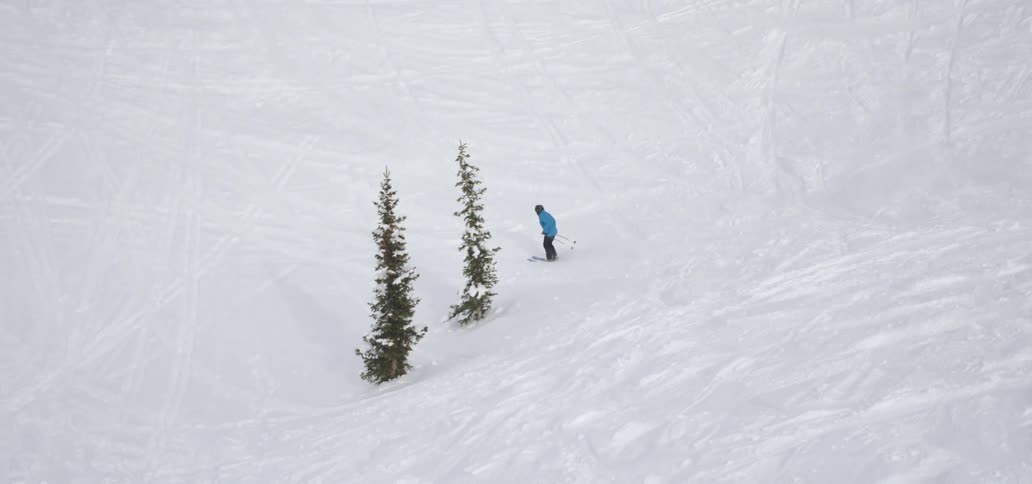 A person skiing down a hill