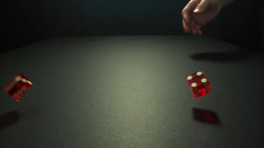 A hand rolls two dice