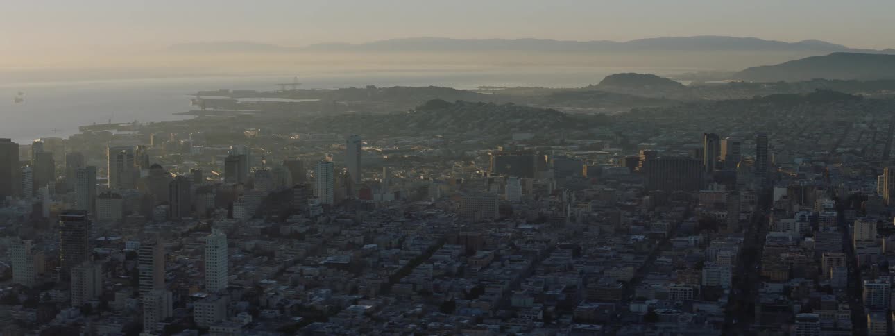 A large city sits on a shore near a body of water