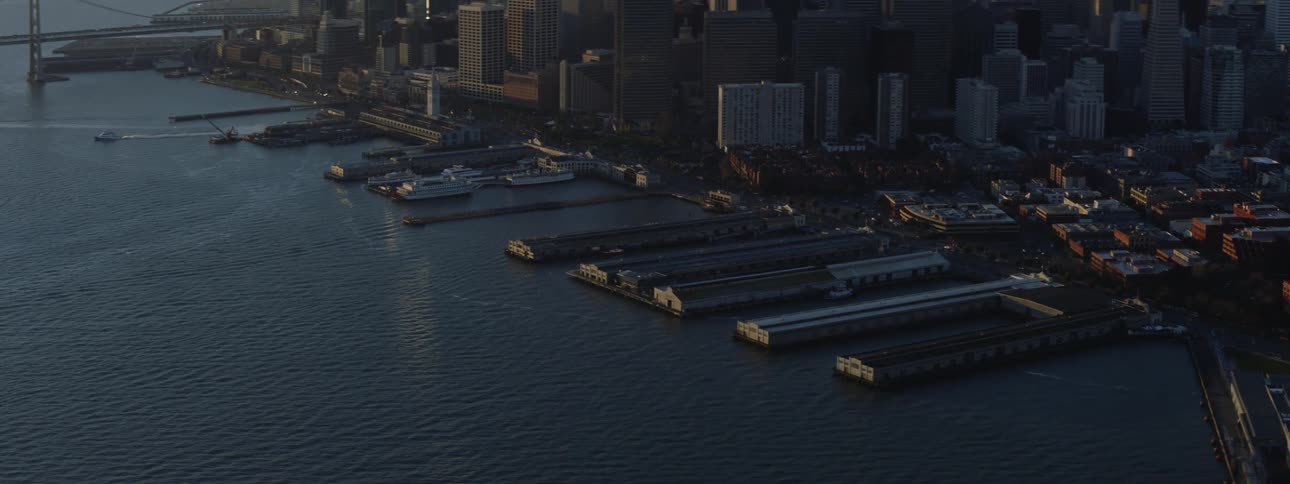 A shipping yard sits near the san francisco skyline