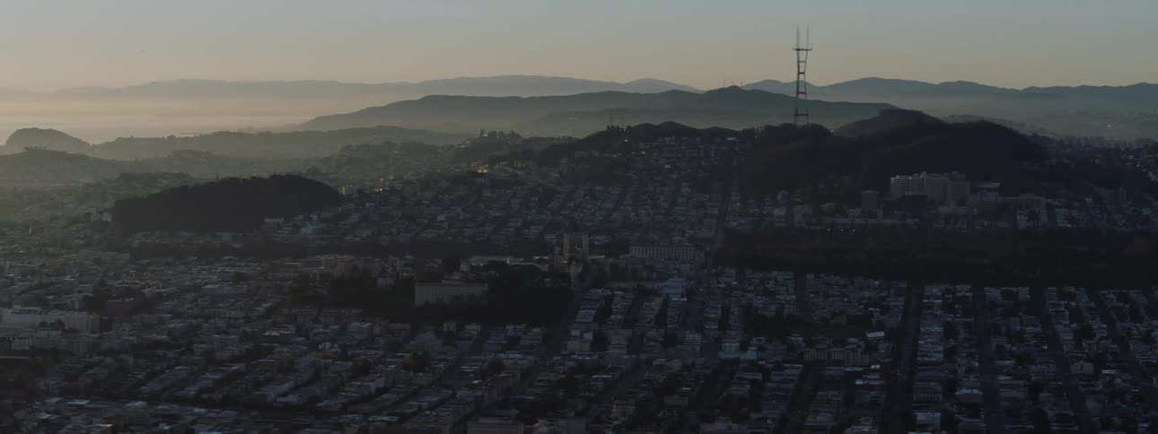 A spread out neighborhood sits in a valley