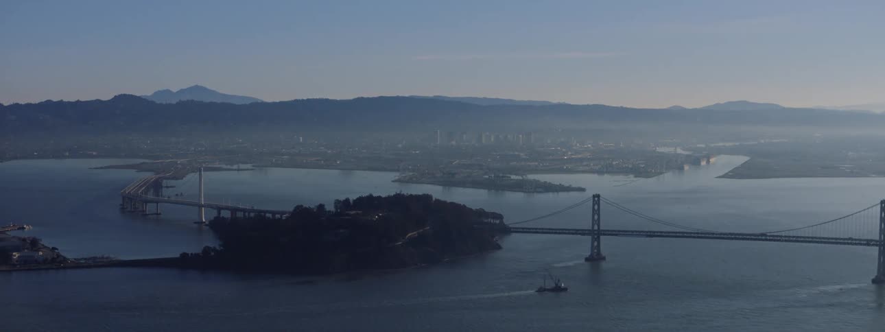 The golden gate bridge stretches across a bay off the coast of san francisco