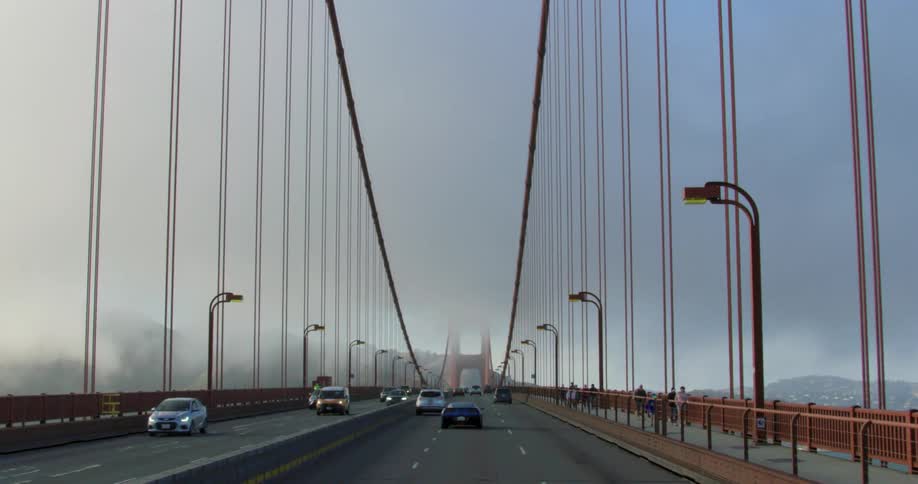 Cars are driving on bridge