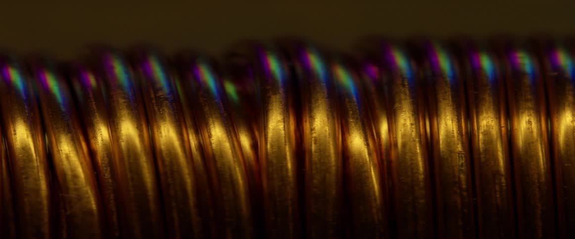Colors rotate on pieces of gold wiring