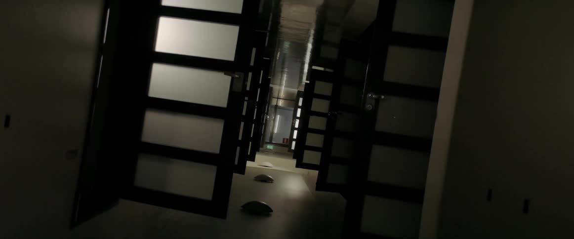 Lights flash in a hallway filled with open doors