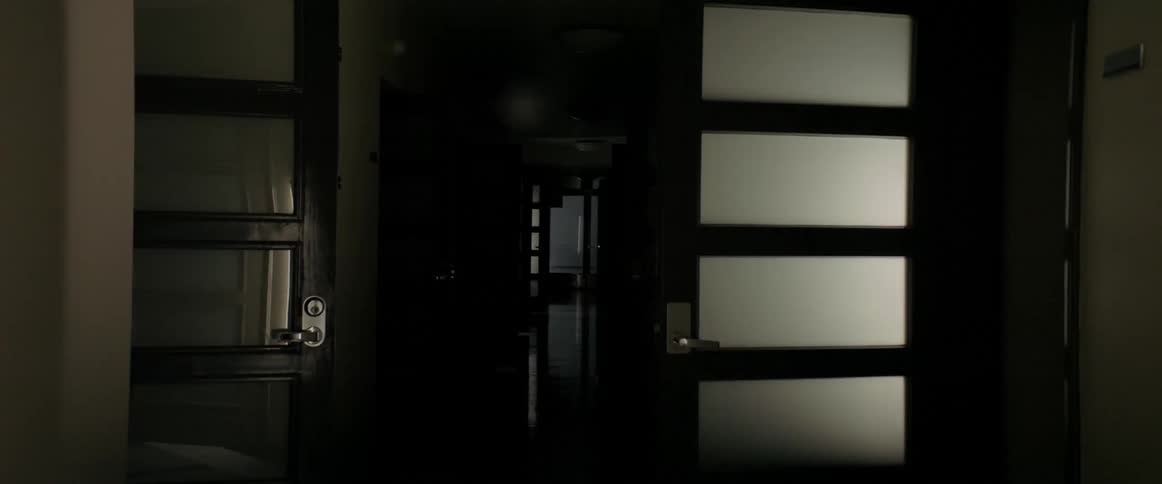 Time lapse of doors in hallway opening and closing