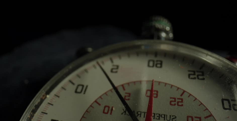 The hands tick on a stopwatch