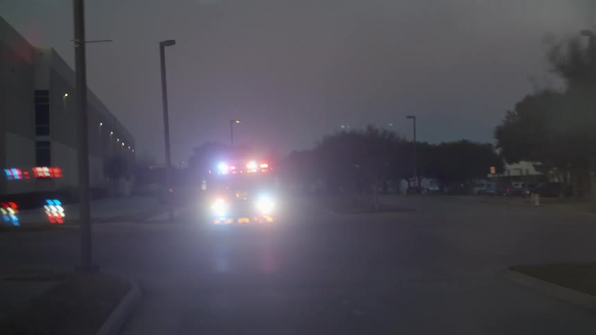 The fire truck races down the road