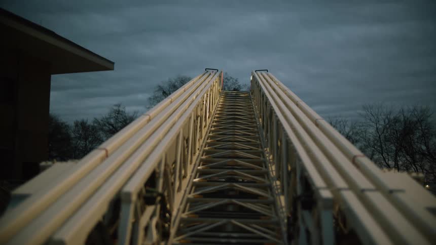 A turntable ladder of the fire truck is being operated