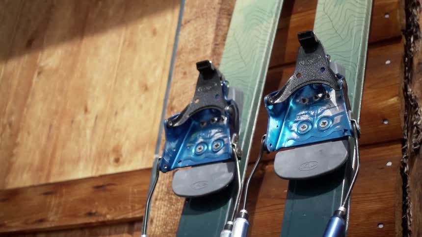 Skis sitting on the wood floor