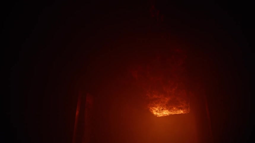 Flames shooting out a buildings window grow taller and brighter