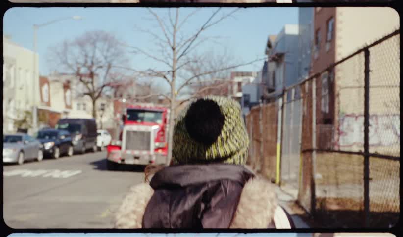Woman walks down the street in the neighborhood