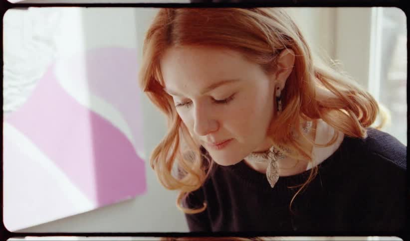 Redhead woman inside a room on film