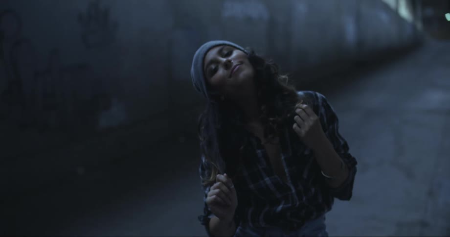 A teenager dances in the street