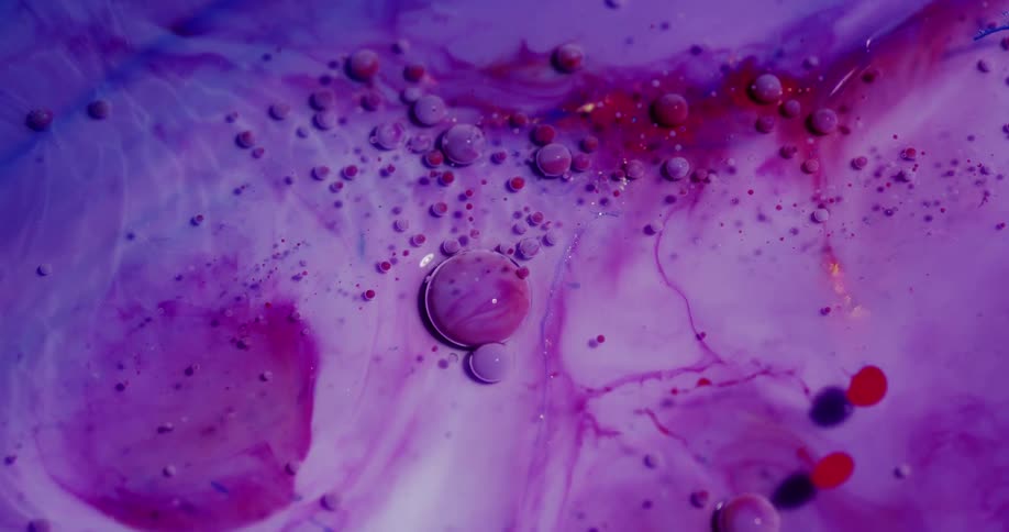 Colored liquid dyes mixing together