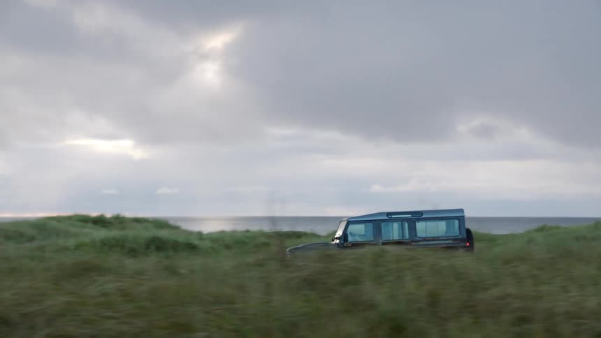All terrain vehicle drives to grassland near the coast