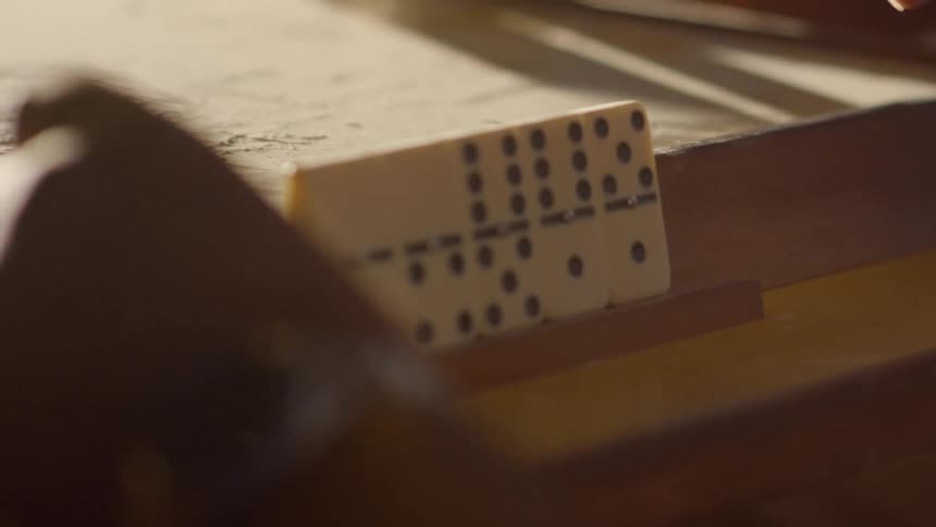 People are playing dominoes