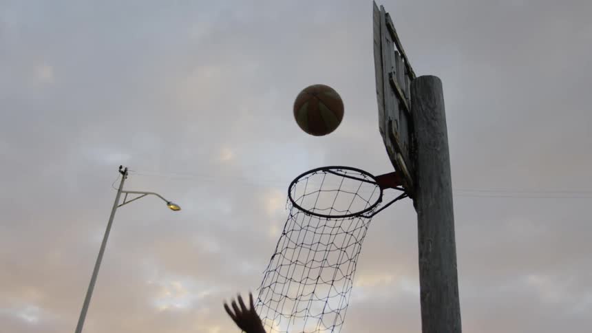 A man shoots the basketball