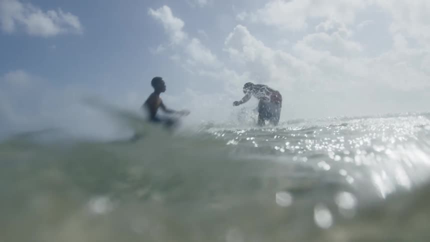 Two children play in the water