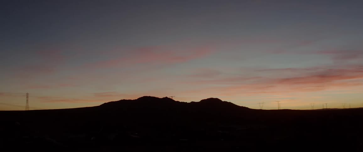 Sun sets behind the mountains