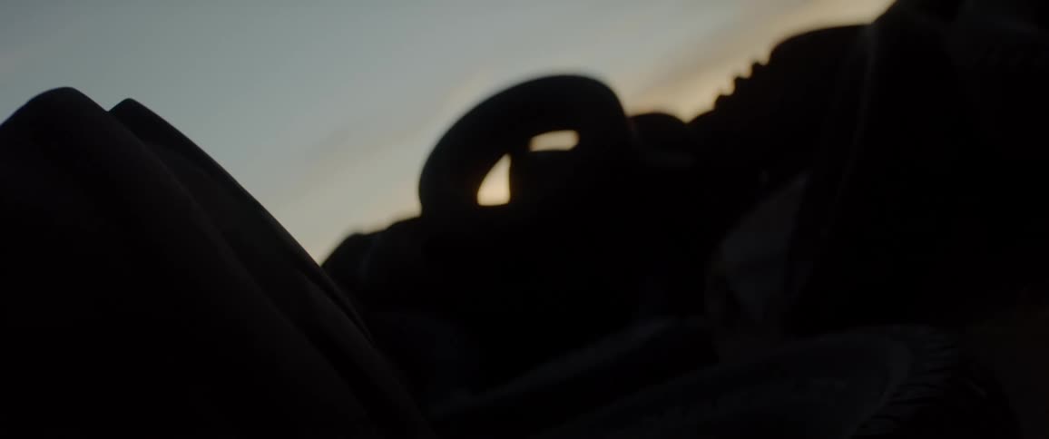Pile of tires at sunset