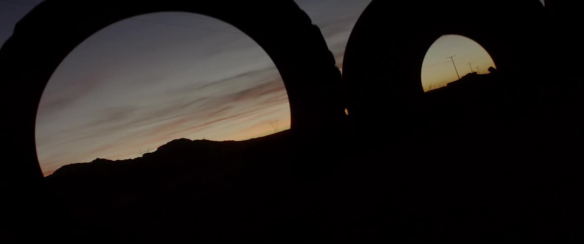 A sunset viewed through some tire compounds