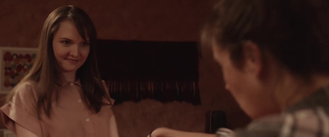 Two women dancing in a room